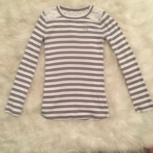 Gray and white striped long sleeved shirt